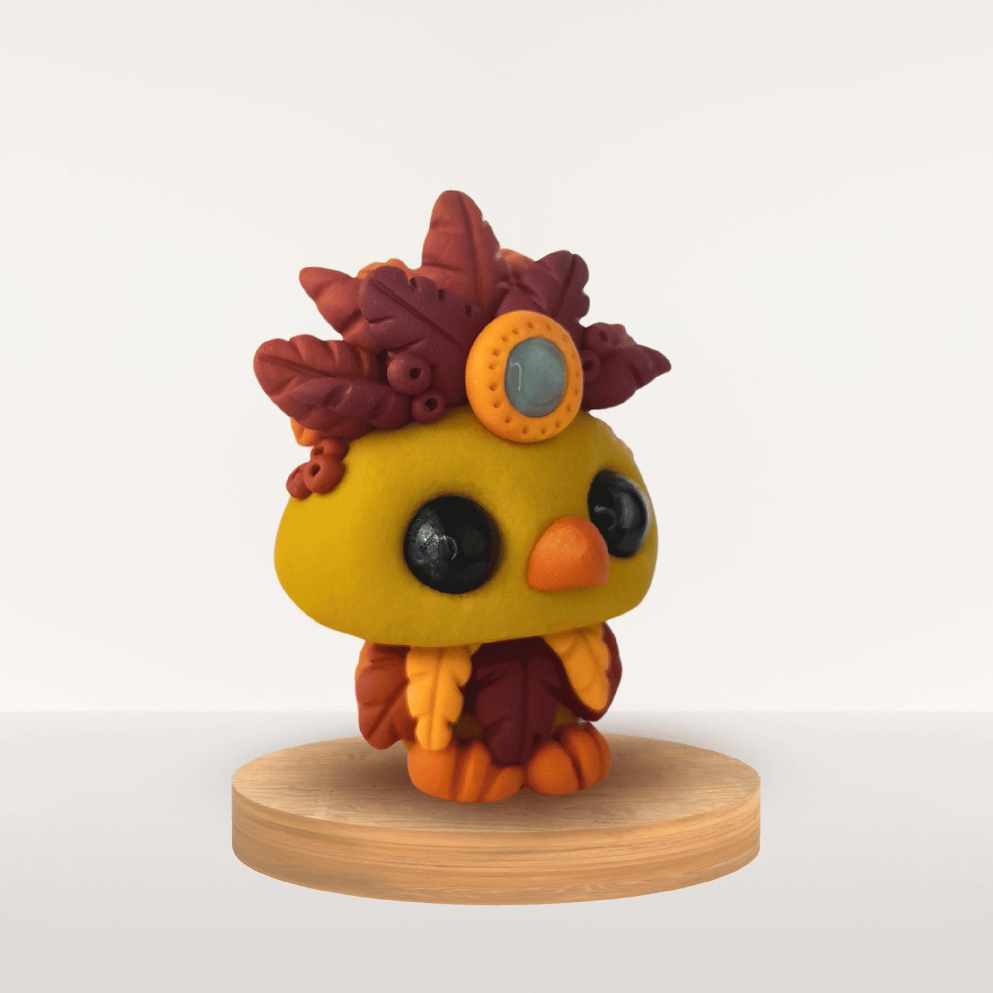 Talisman Plume Curcuma – création artisanale en pâte Fimo