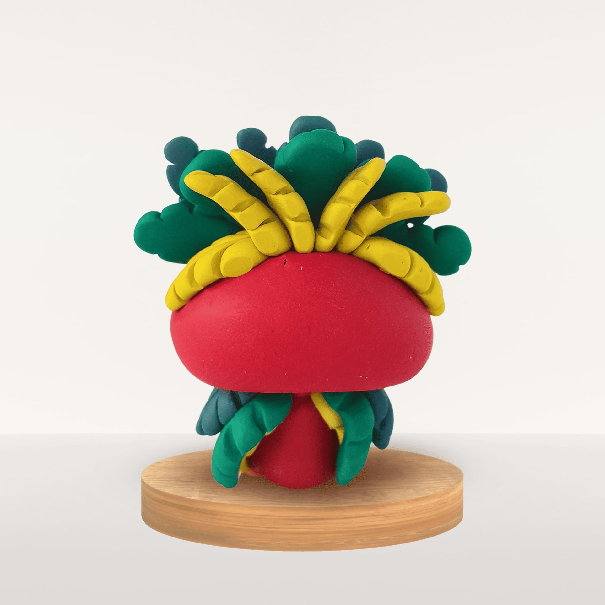 Plume grenat – symbole de vitalité, force intérieure et ancrage